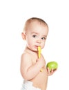 Small beautiful baby girl with green apple Royalty Free Stock Photo