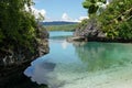 small but beautiful bay in the island of Philippine, the water is crystal clear, with rocks and blue sky.