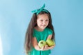 Small beautiful girl eating fresh fruit Green Apple Royalty Free Stock Photo