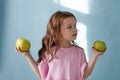 Small beautiful girl eating fresh fruit Green Apple Royalty Free Stock Photo