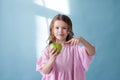 Small beautiful girl eating fresh fruit Green Apple Royalty Free Stock Photo