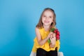 Small beautiful girl holding a fresh radish healthy food Royalty Free Stock Photo
