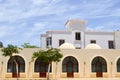 Small beautiful neat old ancient stone clay Arab Islamic Muslim houses with windows with round domes in the desert in a tropical Royalty Free Stock Photo