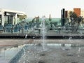 A small beautiful singing fountain in the open air, on the street. Drops of water, jets of water frozen in the air in flight Royalty Free Stock Photo