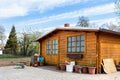 Small beautiful wooden house shed or storage hut for garden tools equipment and bicycles at backyard at beautiful Royalty Free Stock Photo