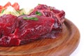 Small beef chunks on wooden plate Royalty Free Stock Photo