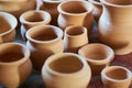 Small beige clay pots, background, texture Royalty Free Stock Photo