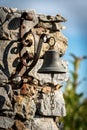 Small bell hanging on the wall - Tellaro village Liguria Italy Royalty Free Stock Photo