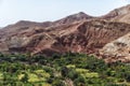 Small Berber village located in a green oasis valley with fields and palm trees , Morocco in the Atlas Mountains Royalty Free Stock Photo