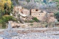 Berber village by river in Atlas mountains, Morocco Royalty Free Stock Photo