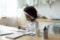 Small biracial girl child study online on gadget Royalty Free Stock Photo