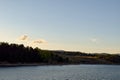 Small birds flying over Lake Jindabyne and surrounding mountains Royalty Free Stock Photo