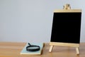 Small black board on wooden table,blank blackboard isolated