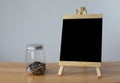 Small black board on wooden table,blank blackboard isolated