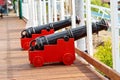 Small Black Canons And Red Carts