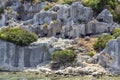 Small black goats cadge on historical Lycian ruins near Mediterranean sea Royalty Free Stock Photo