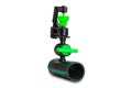 Small black and green color plasticwater sprinkler mounted on old dirty p.e.tube Royalty Free Stock Photo