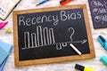 Small blackboard with chart about recency bias.