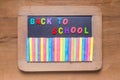 Small blackboard with color chalks and color English alphabets, Royalty Free Stock Photo