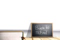 Small blackboard with the text of back to school Royalty Free Stock Photo