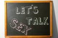 Small blackboard with written phrase `LET`S TALK SEX` Royalty Free Stock Photo