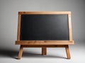 small blank chalkboard wooden leg stand and chalk stains education background with copy space. for your text