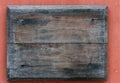 Blank, wooden, weathered sign on wall