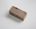 A Small Block of Cut Wood on a White Background Royalty Free Stock Photo