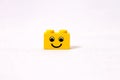 A small block of yellow lego cube