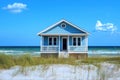 Small blue beach house on the shore offering seclusion and refuge Royalty Free Stock Photo