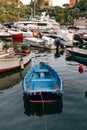 The small blue boat in the fishing port of Portofino - Italy