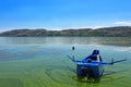 Small blue boat painted as Greece flag Royalty Free Stock Photo