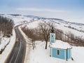 Small blue chapel with snow