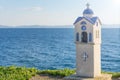 Small blue church near Neos Marmaras in Greece on summer with blue sea water in background Royalty Free Stock Photo