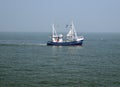 Small Blue Fish Trawler Fishing In The North Sea