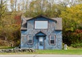 Tiny blue house surrounded by fall foliage near Wyalusing, Pennsylvania, U.S
