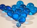 A small blue marble leading a larger group Royalty Free Stock Photo