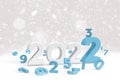 2022 with small blue number as new year math on snow background