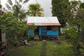 Small blue wooden house in the city of tortuguero, costa rica