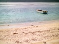 Small boat anchored off a Seychelles beach Royalty Free Stock Photo