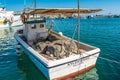 Marsaxlokk, Malta, August 2019. Fishing boat with nets on board at the pier.