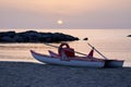 Small boat on the beach during sunset, in Belvedere Marittimo, Italy