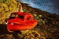 Small boat beached at sunset in Scotland