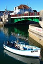 Small boat by the bridge, Weymouth. Royalty Free Stock Photo