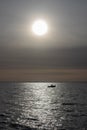 Small boat captured in the sunlight off the coast of Thorpe Bay, Essex, England, United Kingdom Royalty Free Stock Photo