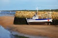 Small boat at ebb tide