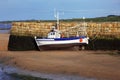 Small boat at ebb tide