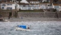 Small boat ferrying passengers across choppy sea from Marazion to St Michael`s Mount in Marazion, Cornwall, UK