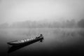 Small boat foggy morning on the river