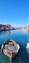 a small boat in the Italian port of Genoa, Liguria